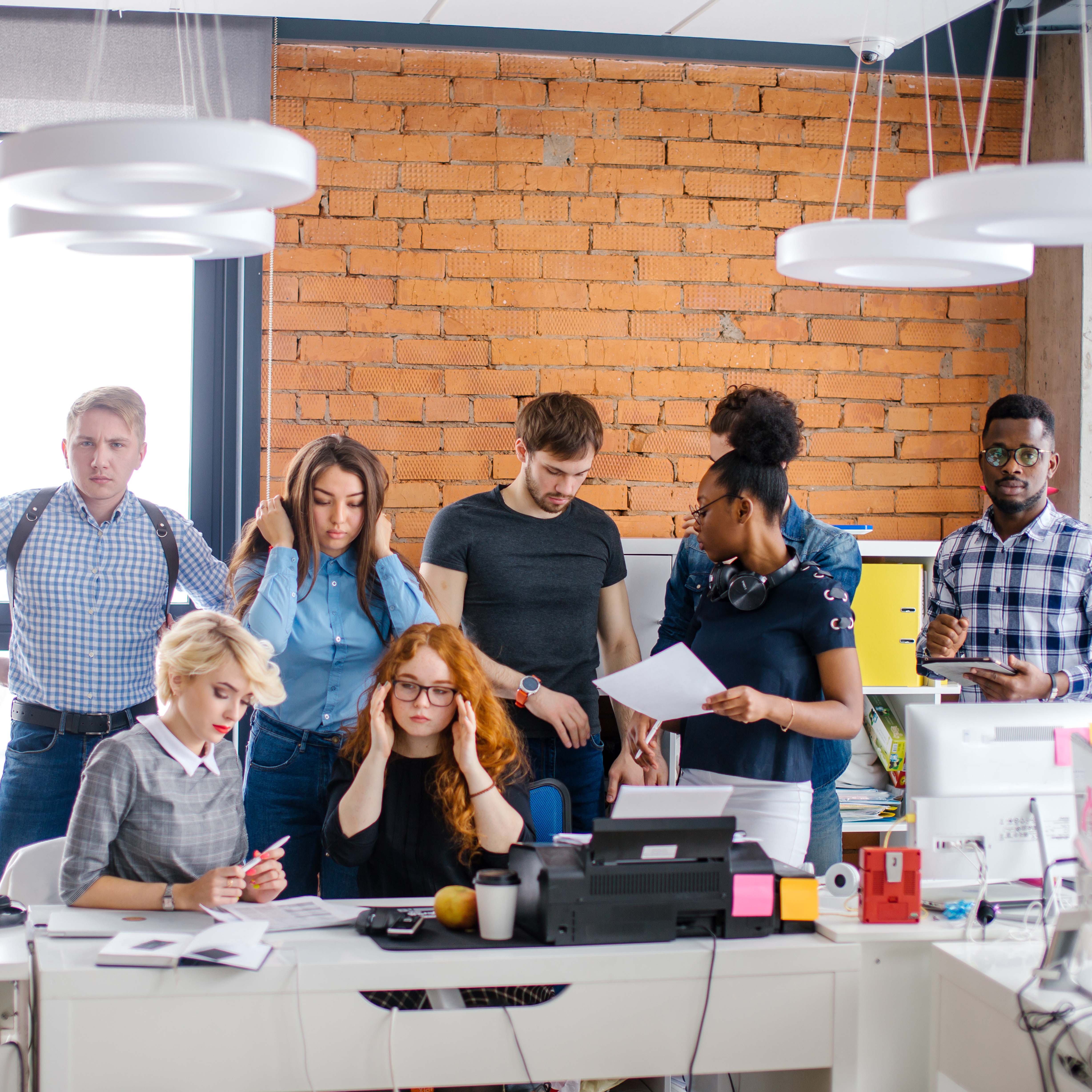 Screaming businessman drowning under a lot of paperwork