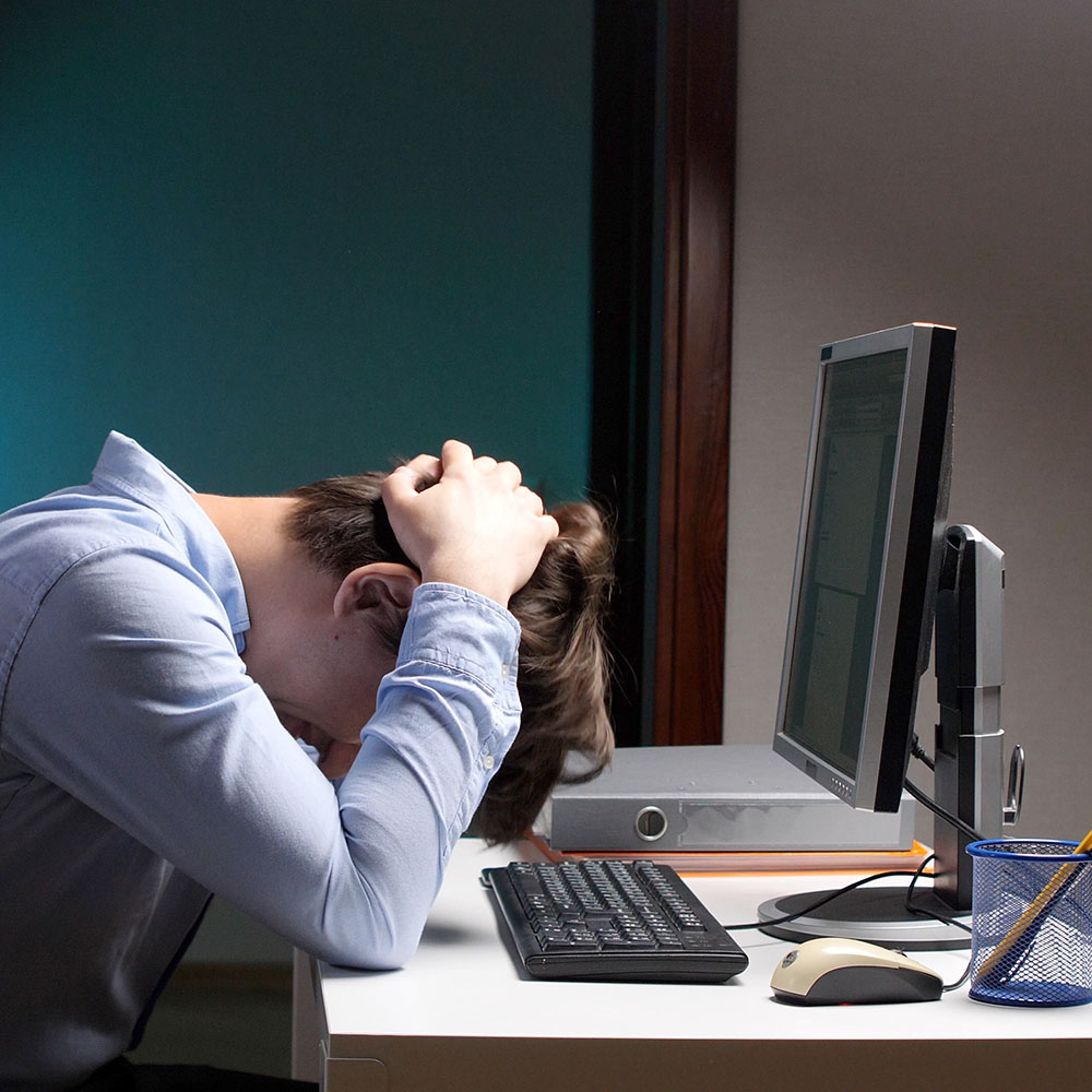 Screaming businessman drowning under a lot of paperwork